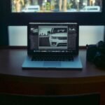 MacBook Pro displaying white vehicle